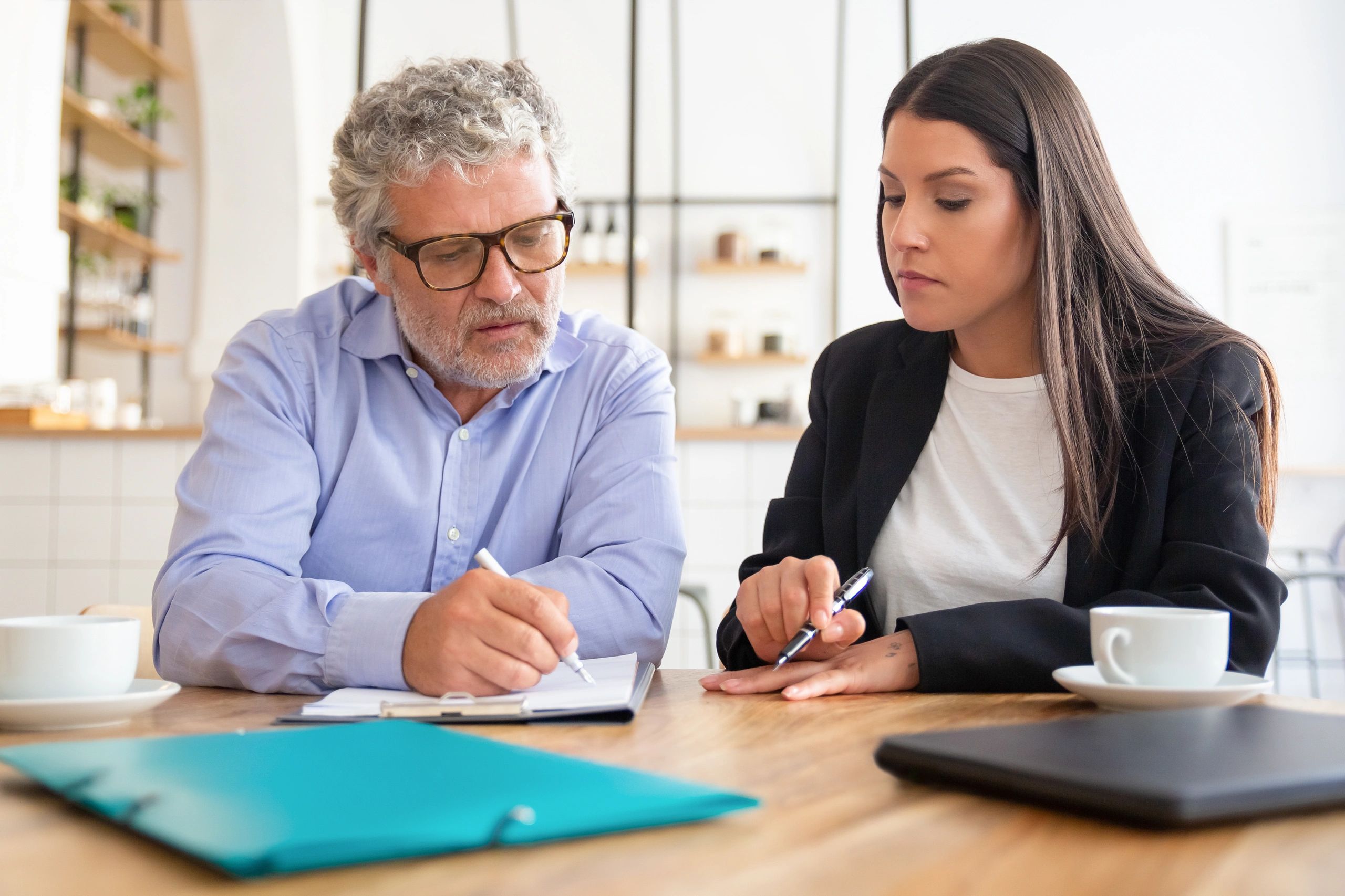 Client reviewing listing paperwork with an agent